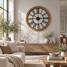 Load image into Gallery viewer, Decor Home Hampton Grove wood and rattan wall clock with Roman numerals in a modern living room