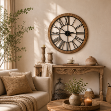 Load image into Gallery viewer, Hampton Grove wood and rattan wall clock with iron Roman numerals in a rustic living room