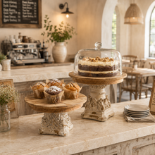 Load image into Gallery viewer, Set of two French Provincial wooden pedestal stands displaying a cake and muffins.