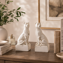 Load image into Gallery viewer, Maison Leopard Bookends in rustic white resin on a wooden table with books