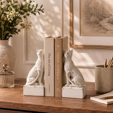 Load image into Gallery viewer, Maison Leopard Bookends in rustic white resin holding books on a wooden table