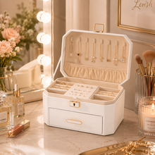 Load image into Gallery viewer, White Decor Home jewellery storage box with necklace hooks, ring slots and lock on a vanity
