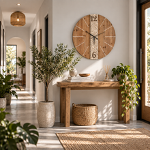 Load image into Gallery viewer, Large rustic wooden wall clock with carved floral detail above a wooden console table
