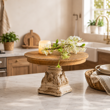 Load image into Gallery viewer, French Provincial rustic wooden pedestal stand with a candle and white flowers on a marble counter
